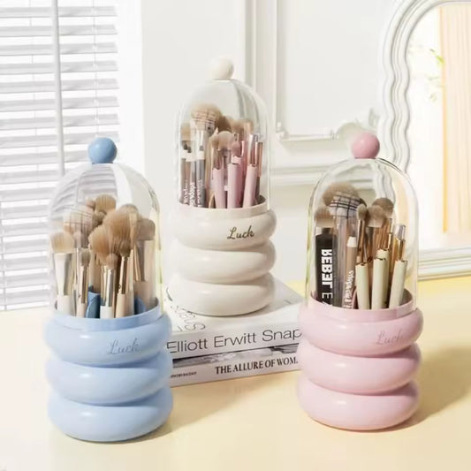 Dustproof makeup organizer with lid in pastel blue white and pink holding various makeup brushes