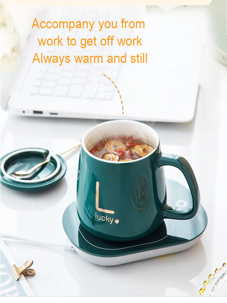 Clarify.pk ceramic mug with warmer in dark green holding hot tea on matching warming plate
