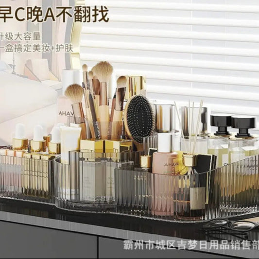 Luxury acrylic makeup organizer with multiple compartments holding brushes, bottles, and cosmetics on a vanity