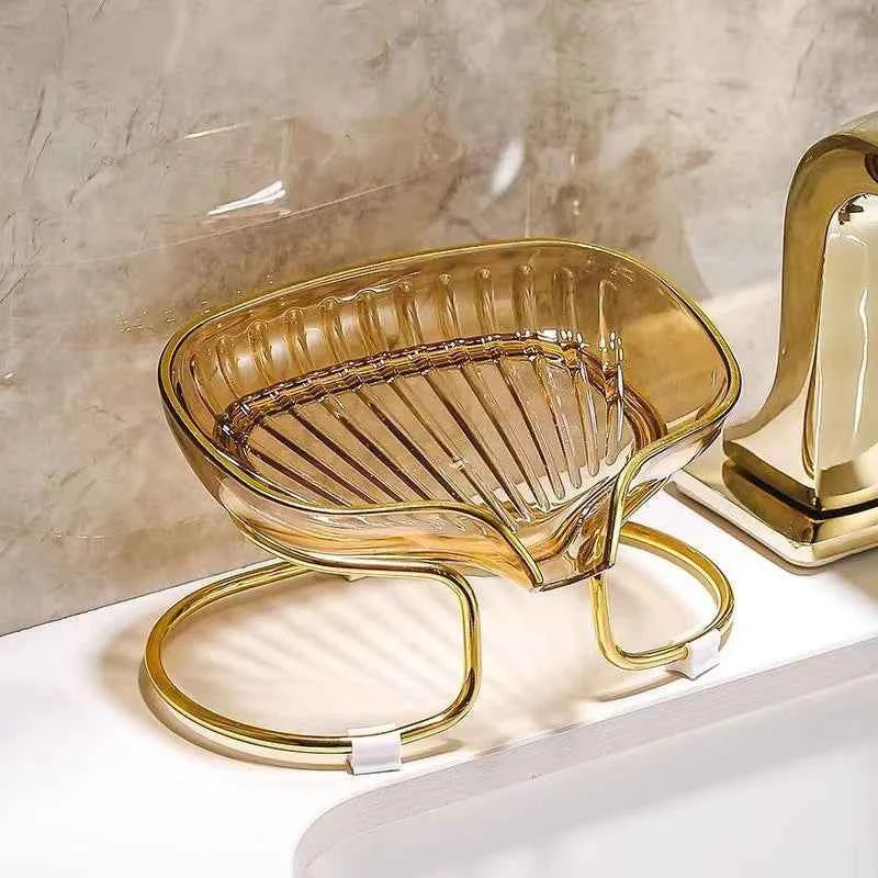 Luxury bathroom soap dish in amber glass with gold metal frame for elegant decor