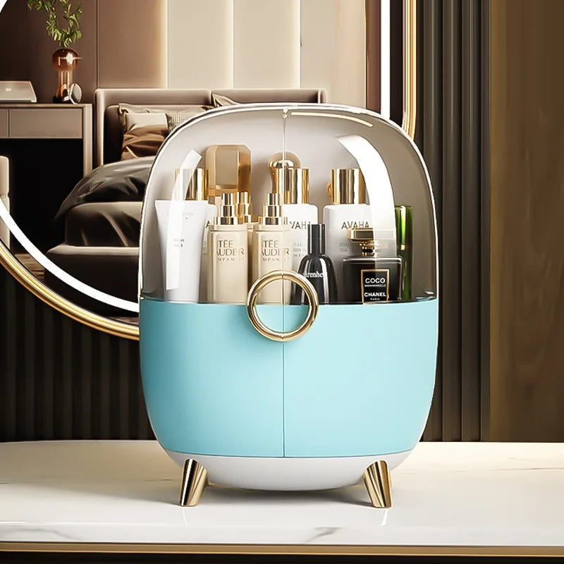 Luxury cosmetics storage box in blue with transparent cover and gold accents holding skincare bottles