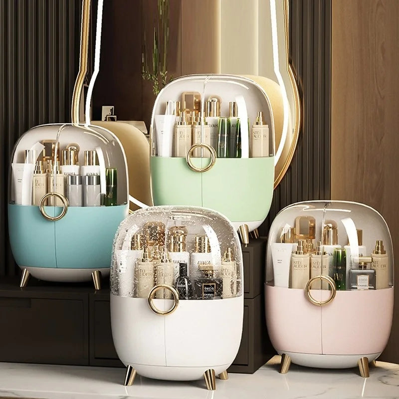 Set of four luxury cosmetics storage box in pastel colors with transparent lids and gold accents