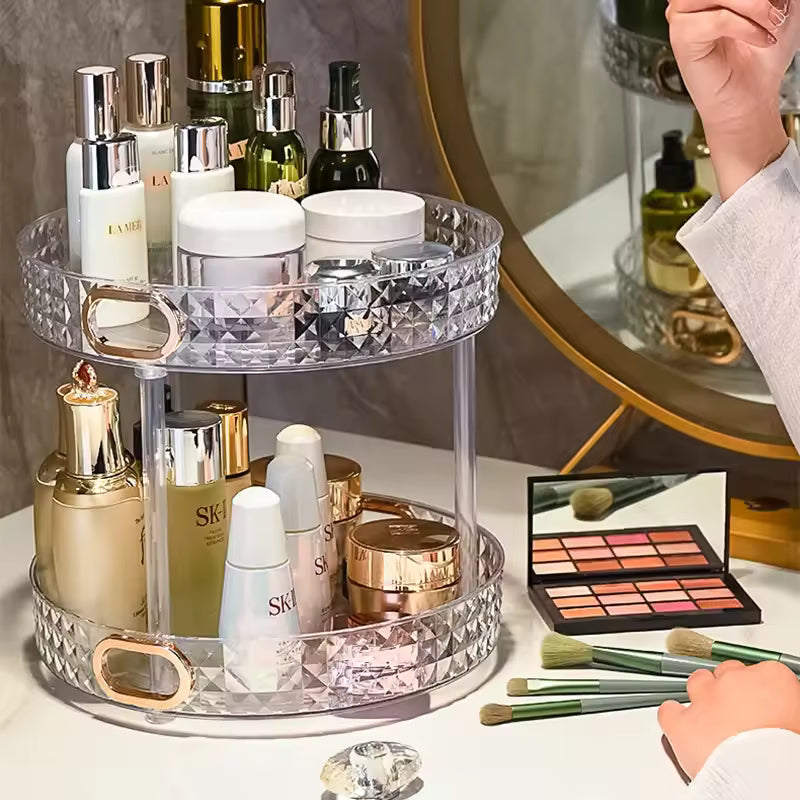 Luxury cosmetics storage rack by Clarify.pk with two clear acrylic tiers holding various beauty products