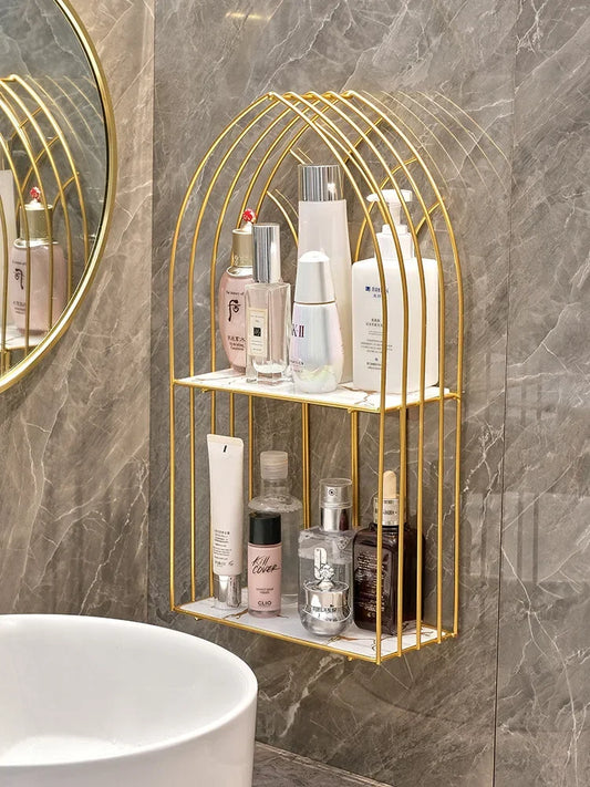 Luxury gold storage rack for bathroom mounted on gray marble wall holding toiletries