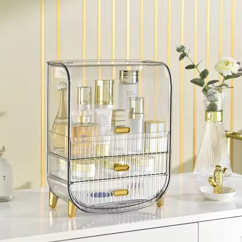 Luxury makeup storage box by Clarify.pk with clear acrylic design and gold accents on white vanity
