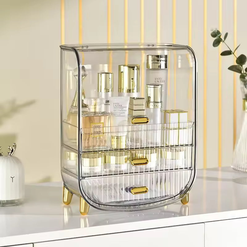 Clear luxury makeup storage box with gold accents and multiple compartments for organizing cosmetics