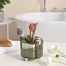 Clarify.pk green makeup brush holder organizer with multiple compartments on bathroom counter