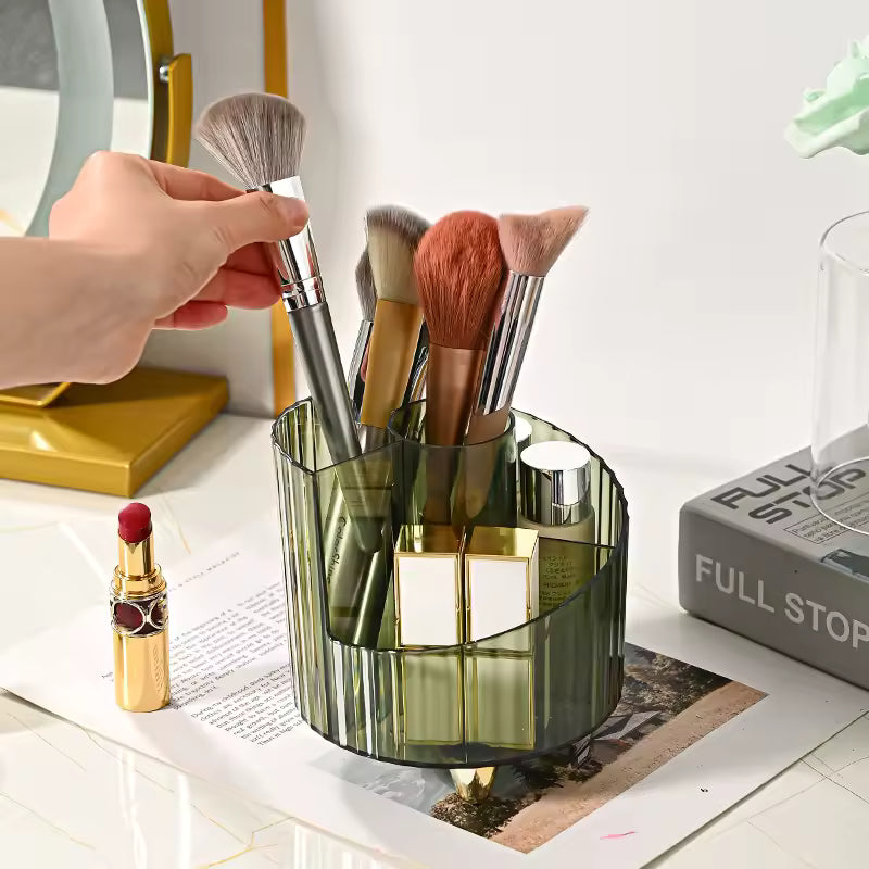 Clear green makeup brush holder organizer with multiple compartments holding makeup brushes and cosmetic items
