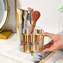 Clarify.pk transparent makeup brush holder organizer with gold accents holding various makeup brushes