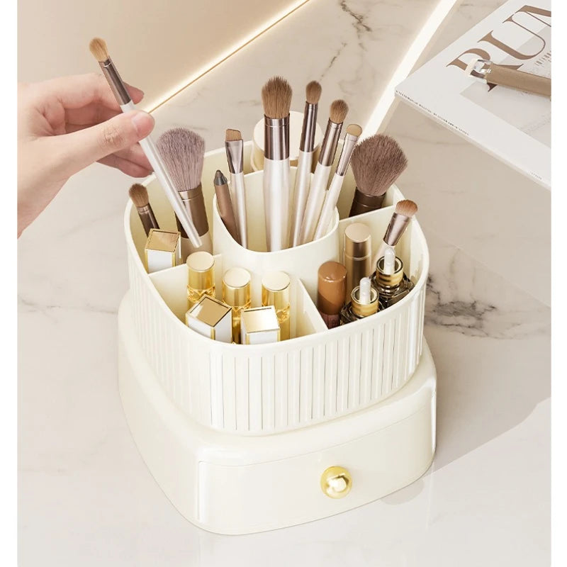Clarify.pk makeup brush storage box in cream holding various makeup brushes and cosmetic items on marble surface