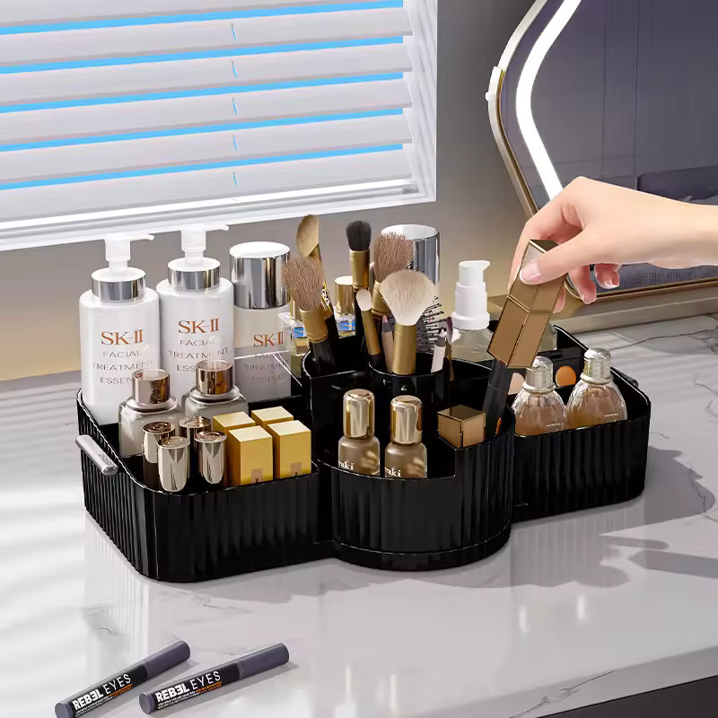 Black makeup organizer box for vanity holding skincare bottles, makeup brushes, and cosmetic products on a white countertop