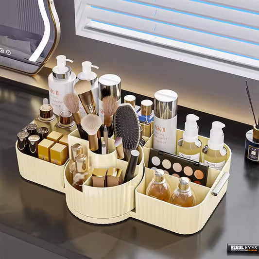 Makeup organizer box for vanity with compartments holding brushes, bottles, lipsticks, and makeup palette on a black countertop