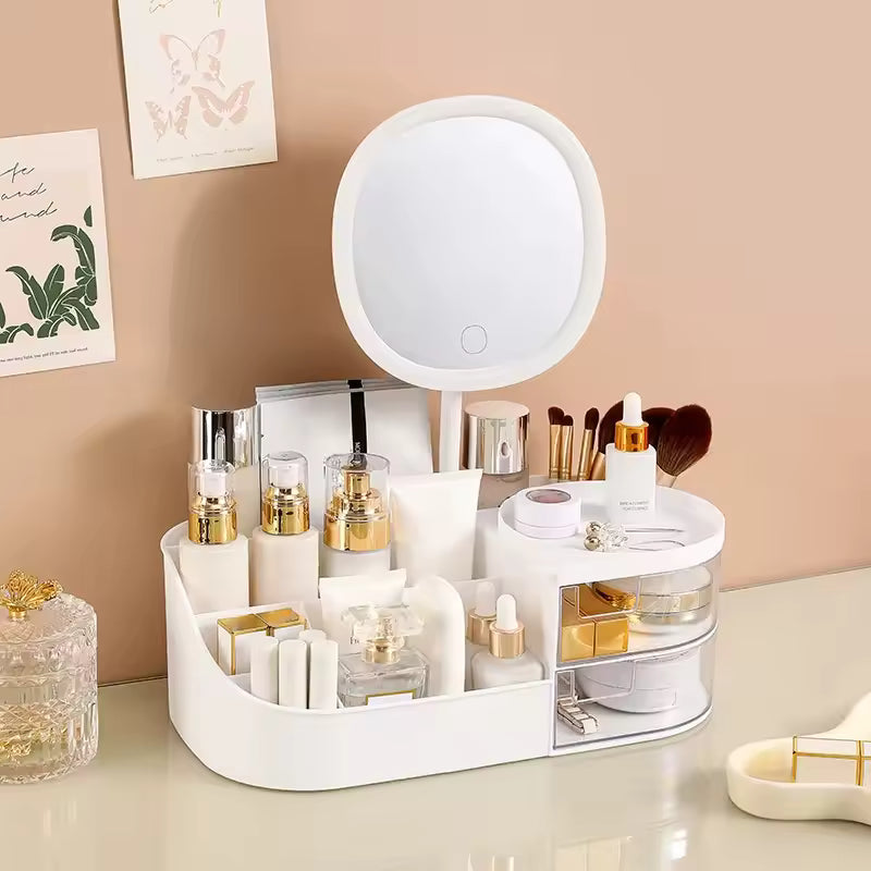White makeup storage box with mirror holding various cosmetics and brushes on a vanity table