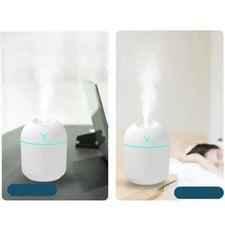 Clarify mini air humidifier 250ml in white emitting mist on desk and bedside table