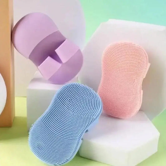 Clarify.pk silicone mini facial cleansing brush in pastel pink blue and purple for gentle skin exfoliation