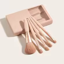 Mini makeup brush set with case in soft pink including six different brush types for precise application