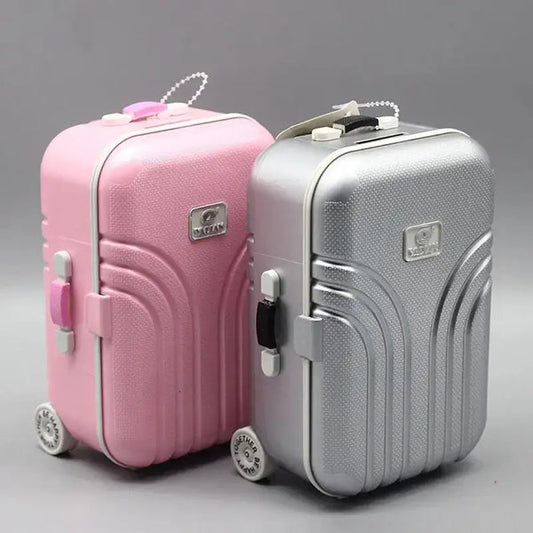 Portable mini musical jewelry box in pink and silver suitcase design with handle and wheels