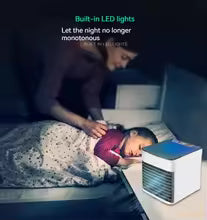 Mini portable air conditioner by Clarify.pk with built-in LED lights cooling a child sleeping peacefully