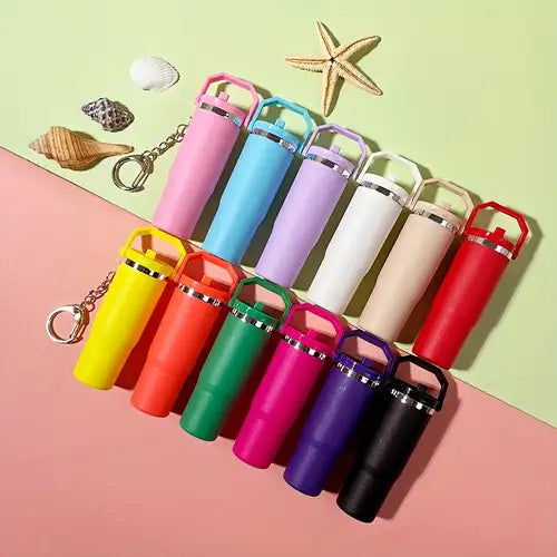 Colorful mini tumbler keychain set with various vibrant colors including pink, blue, purple, white, red, yellow, orange, green, and black