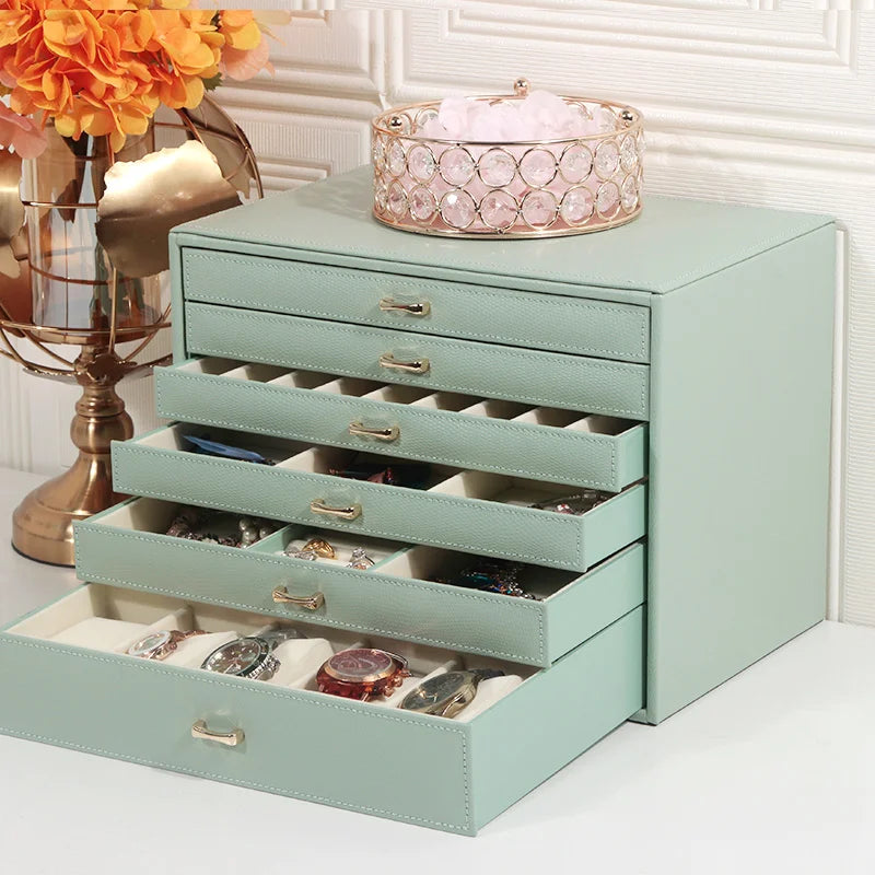 5 layer fashion jewelry storage box in mint green with multiple drawers holding watches and accessories