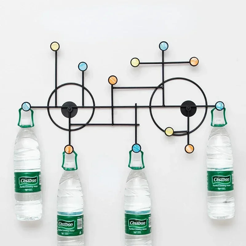 Clarify.pk modern wall mounted coat stand with colorful round hooks and black metal frame holding water bottles