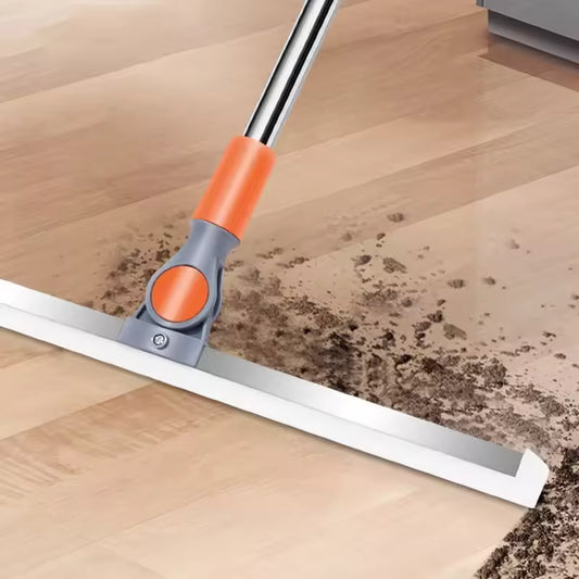 Clarify.pk multi-purpose floor mop cleaning dirt on wooden floor with orange and gray handle