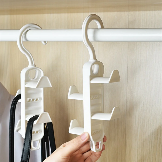 Clarify.pk multi-purpose hanging rack organizer in white hanging on closet rod holding bags