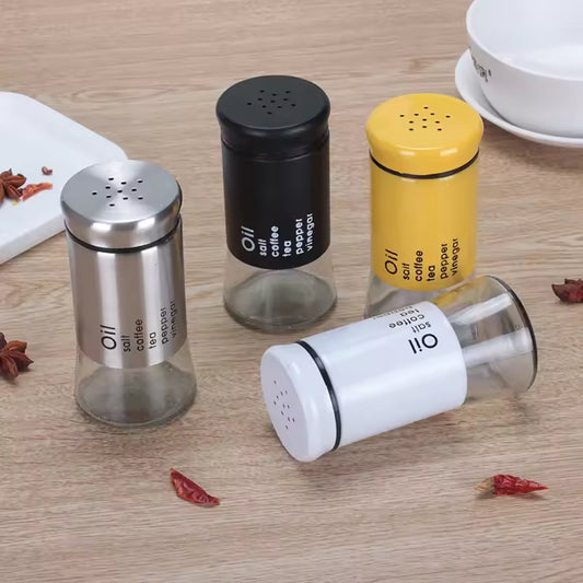 Clarify.pk kitchen spice jar container set with black, yellow, white, and silver lids on wooden surface