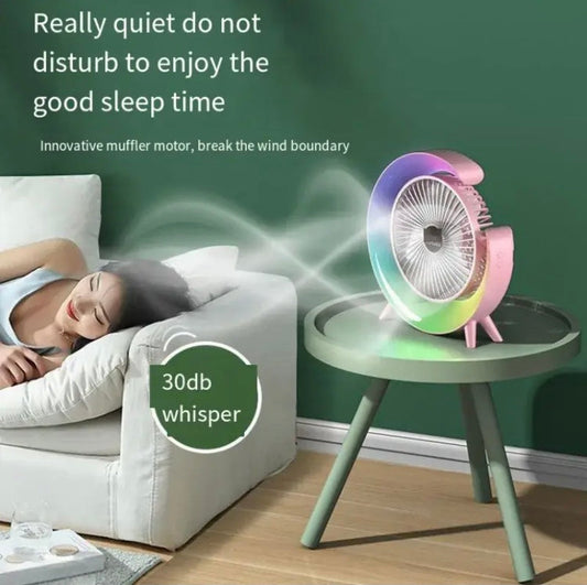 Multifunction desktop fan with LED light on table near woman sleeping quietly on couch