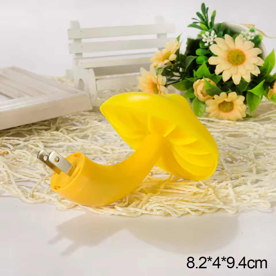 Yellow mushroom night light LED with plug and compact size placed on woven mat near flowers
