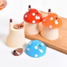 Clarify.pk mushroom toothpick holder set with red, orange, and blue polka dot caps on a wooden tray