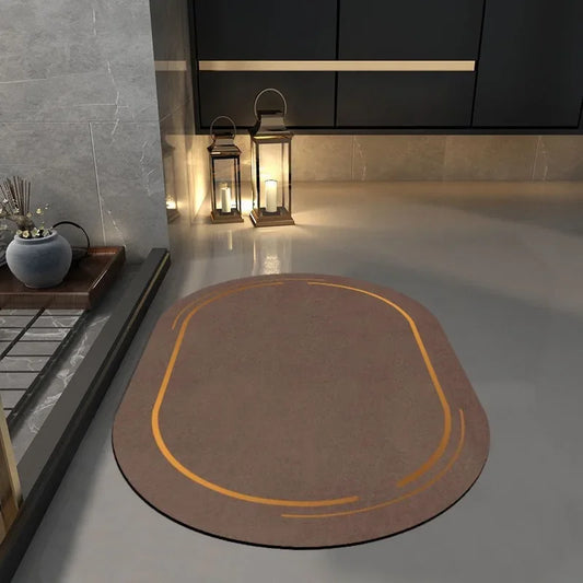 Brown non slip bathroom mat with orange accents placed on a bathroom floor near lantern decor