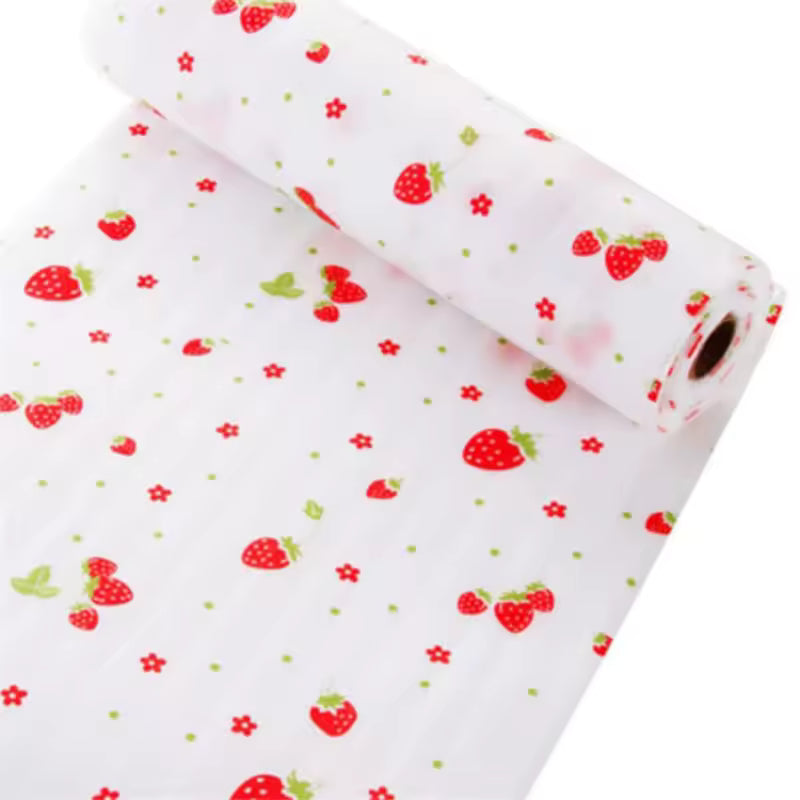 Roll of non-slip cabinet mat for drawers with red strawberry and flower pattern on white background