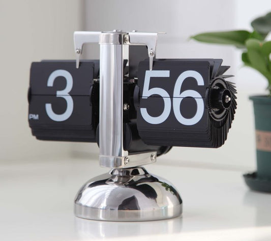 flip desk clock retro metal chrome stand with black numbered flipping cards showing 3 56 pm on white table