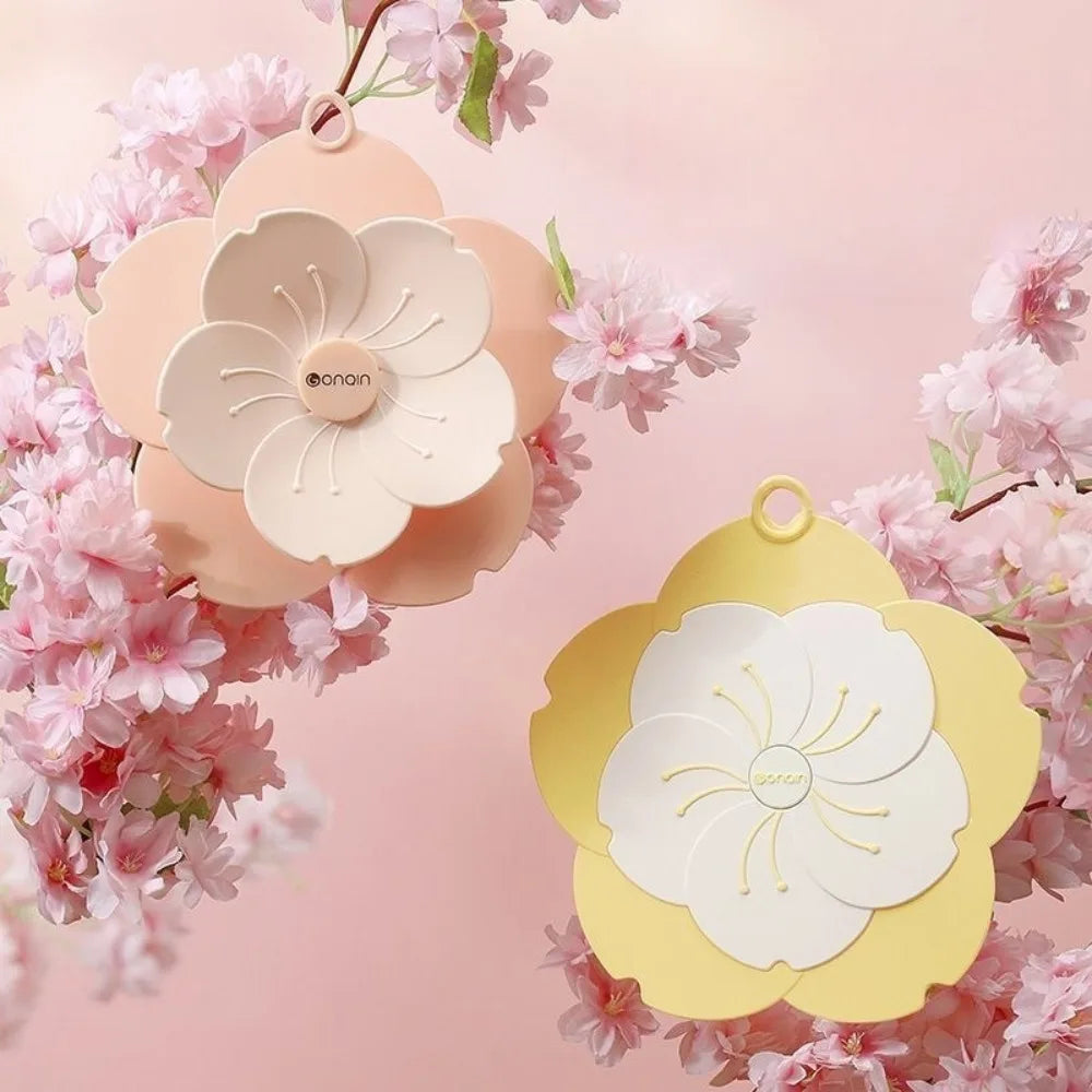 Floral design silicone drain cover for bathroom in pastel pink and yellow colors with decorative petals