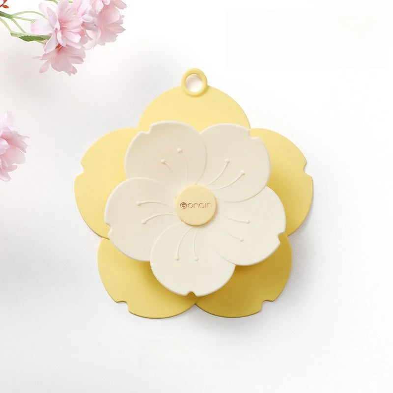 Yellow and white flower-shaped silicone drain cover for bathroom with petal design