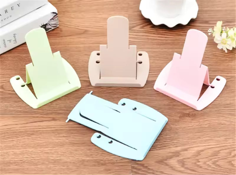 Pack of 4 cell phone stands in pastel colors on wooden surface for easy device support