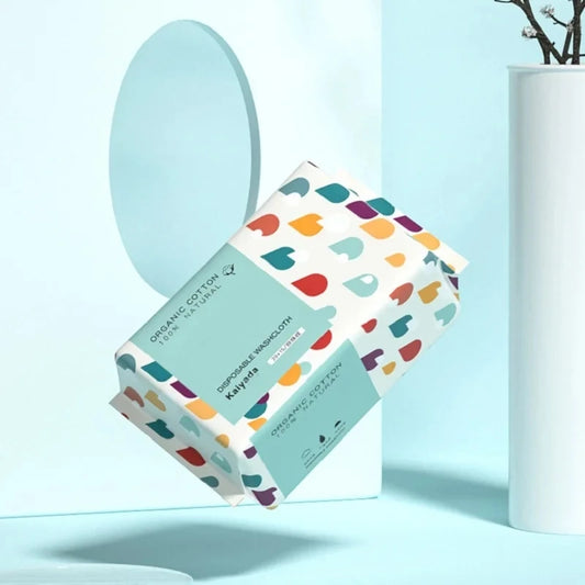 Pack of 70 Cotton Thickened Disposable Face Towel Soft Fabric in colorful packaging on light blue background