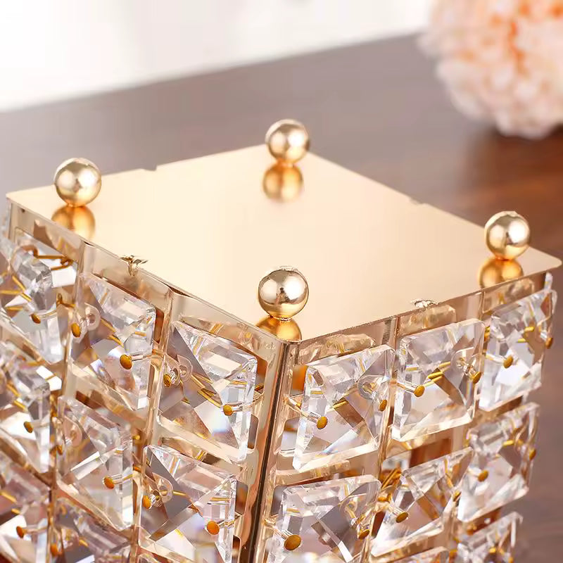 Elegant crystal makeup brush holder with gold accents and a reflective gold top by Clarify.pk