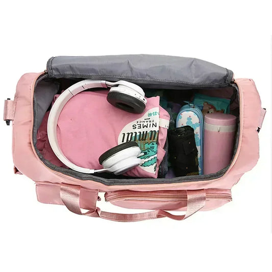 Pink large capacity travel bag open showing packed clothes headphones and water bottle inside