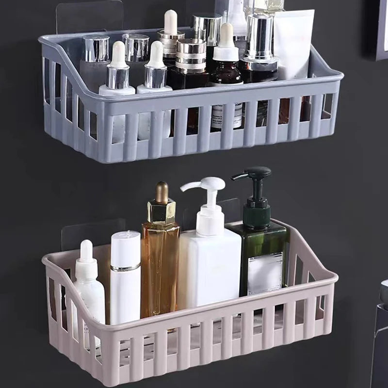 Wall-mounted plastic bathroom shelf organizer holding various skincare and lotion bottles in gray and beige colors
