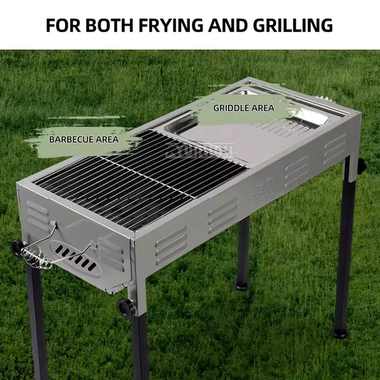 Portable barbecue grill for outdoors with separate barbecue and griddle areas on grass