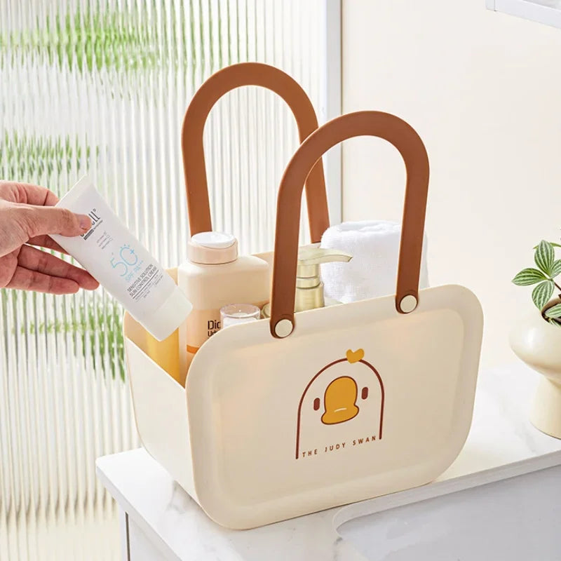 Clarify.pk portable bathroom storage basket in cream with brown handles holding toiletries