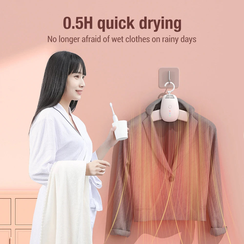 Woman using Clarify.pk portable clothes dryer to quickly dry a blazer indoors in 0.5 hours