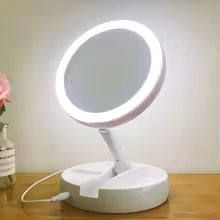 Clarify.pk portable double-sided vanity mirror with LED light and USB charging on wooden table