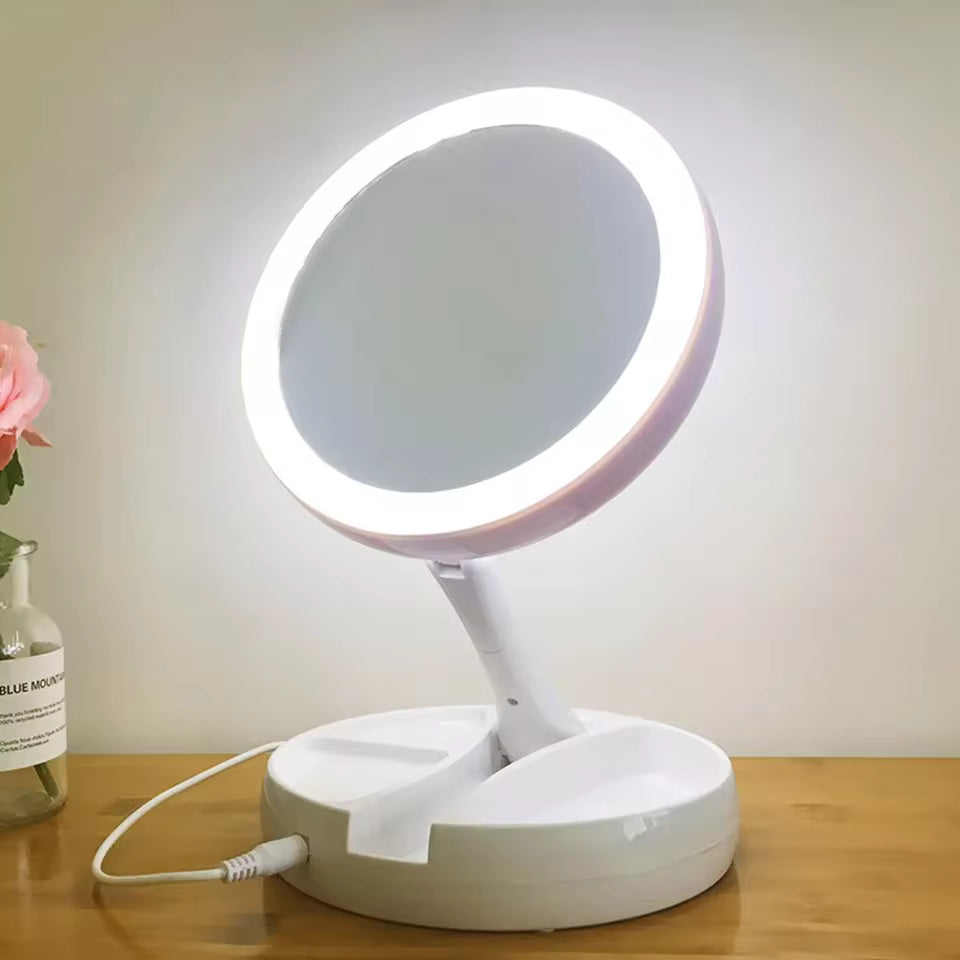 Clarify.pk portable double-sided vanity mirror with LED light and white base on wooden surface