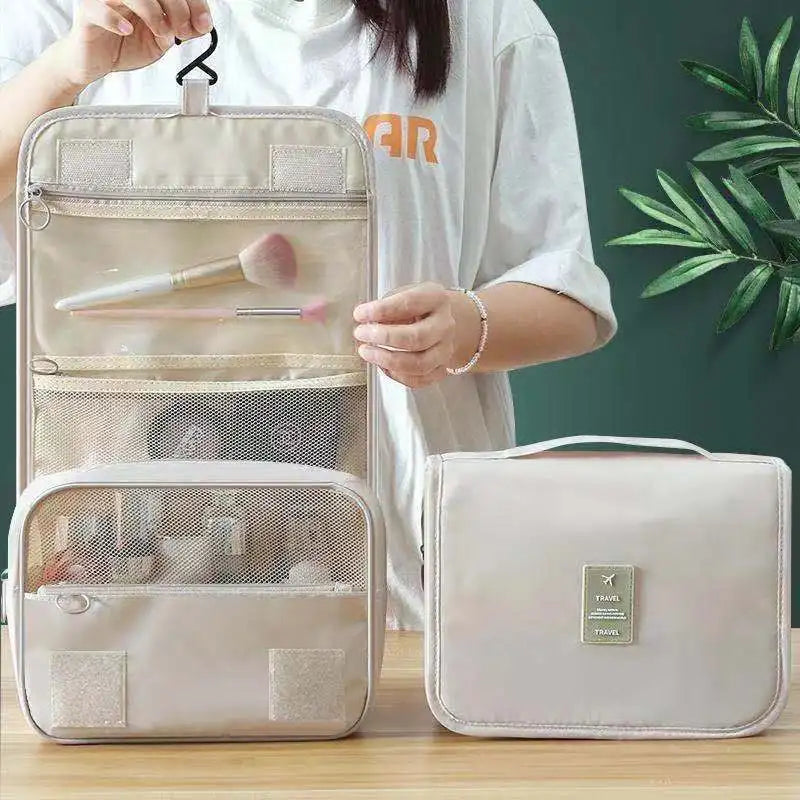 Clarify.pk portable hanging toiletry bag in beige with multiple compartments and transparent pockets