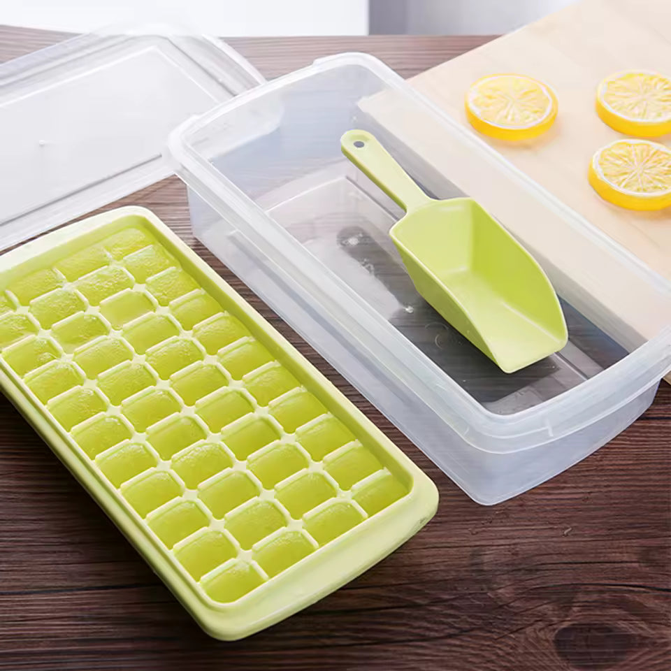 Clarify.pk premium plastic 36 grid ice cube tray with green scoop and clear lid on wooden table