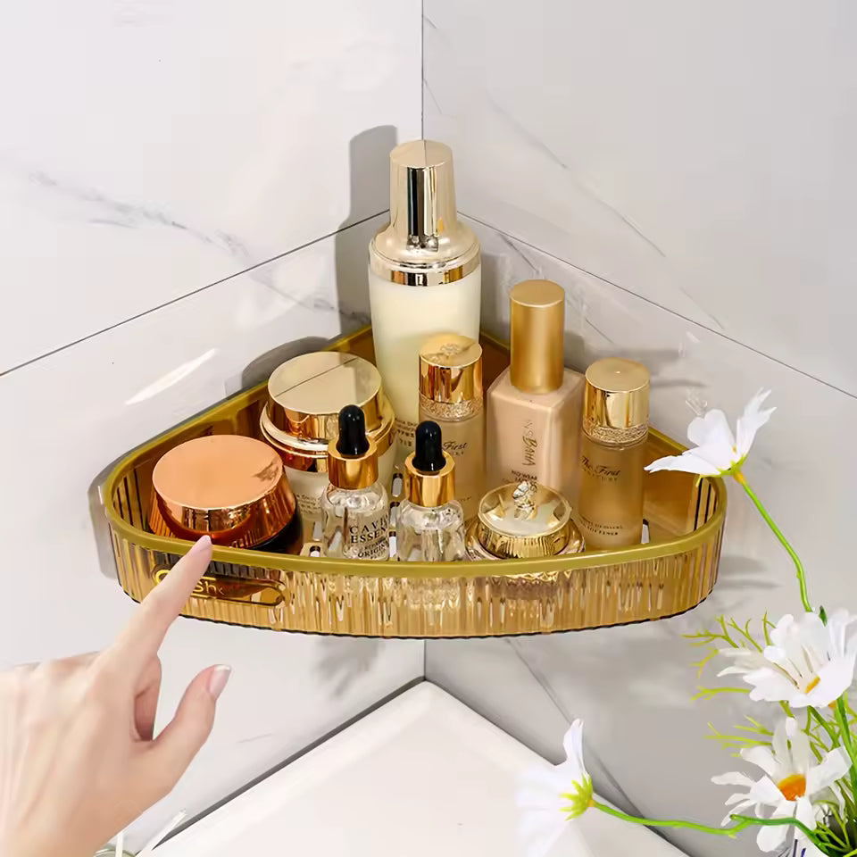 Gold premium wall mount shelf installed in bathroom corner holding skincare and cosmetic bottles
