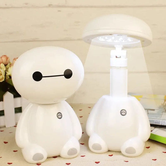 Rechargeable study lamp with eye protection shaped like a cute white robot character on a desk